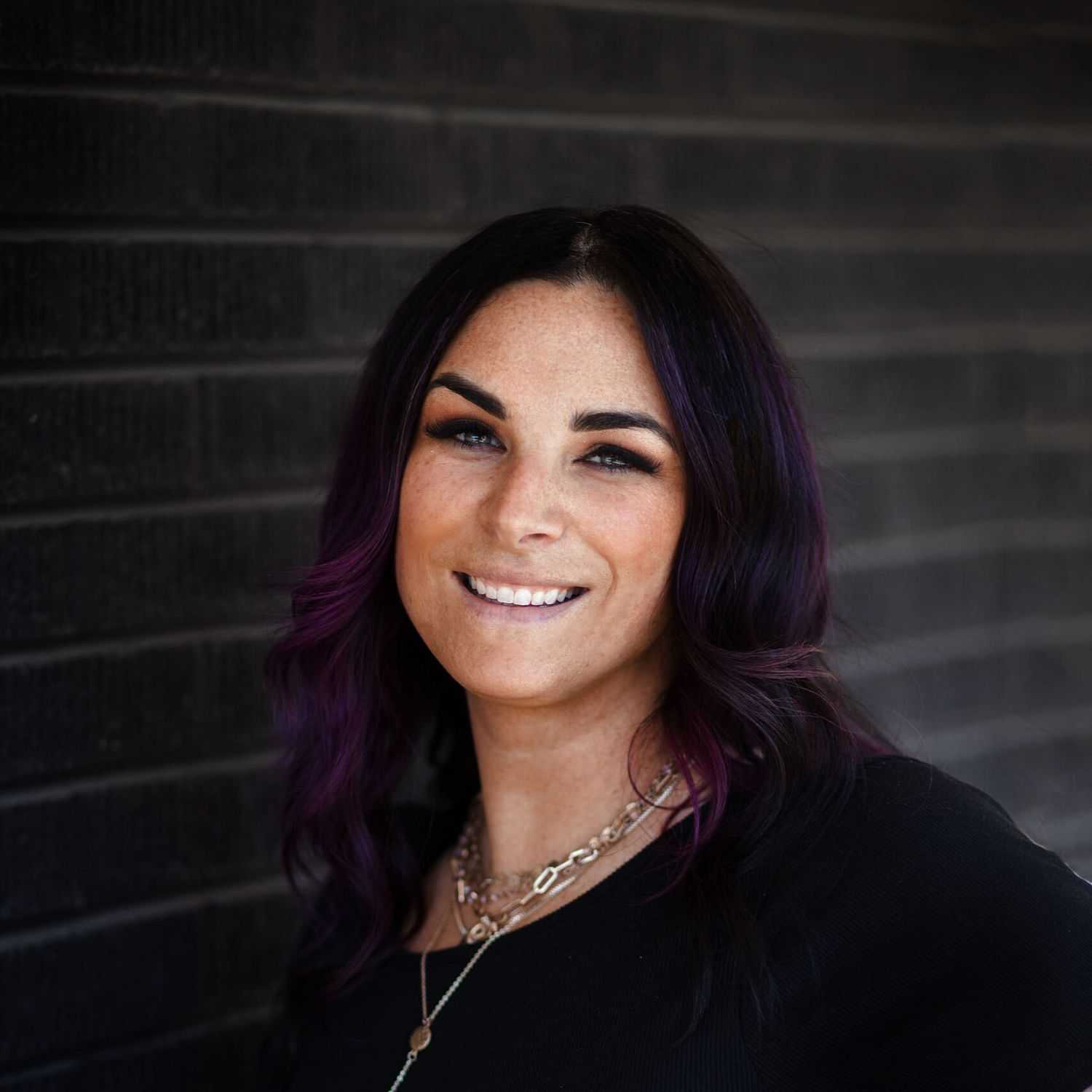 Portrait of Magi Gordon, a professional stylist at Style Bar Salon, showcasing their expertise and style.