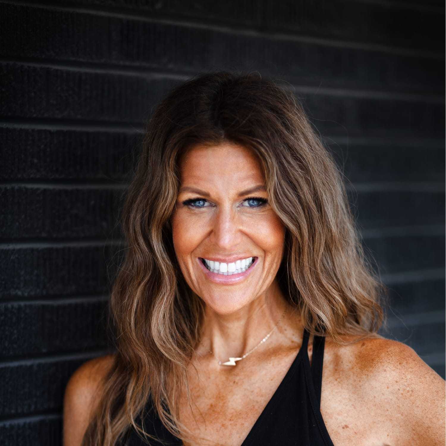 Portrait of Marnie Weir, a professional stylist at Style Bar Salon, showcasing their expertise and style.