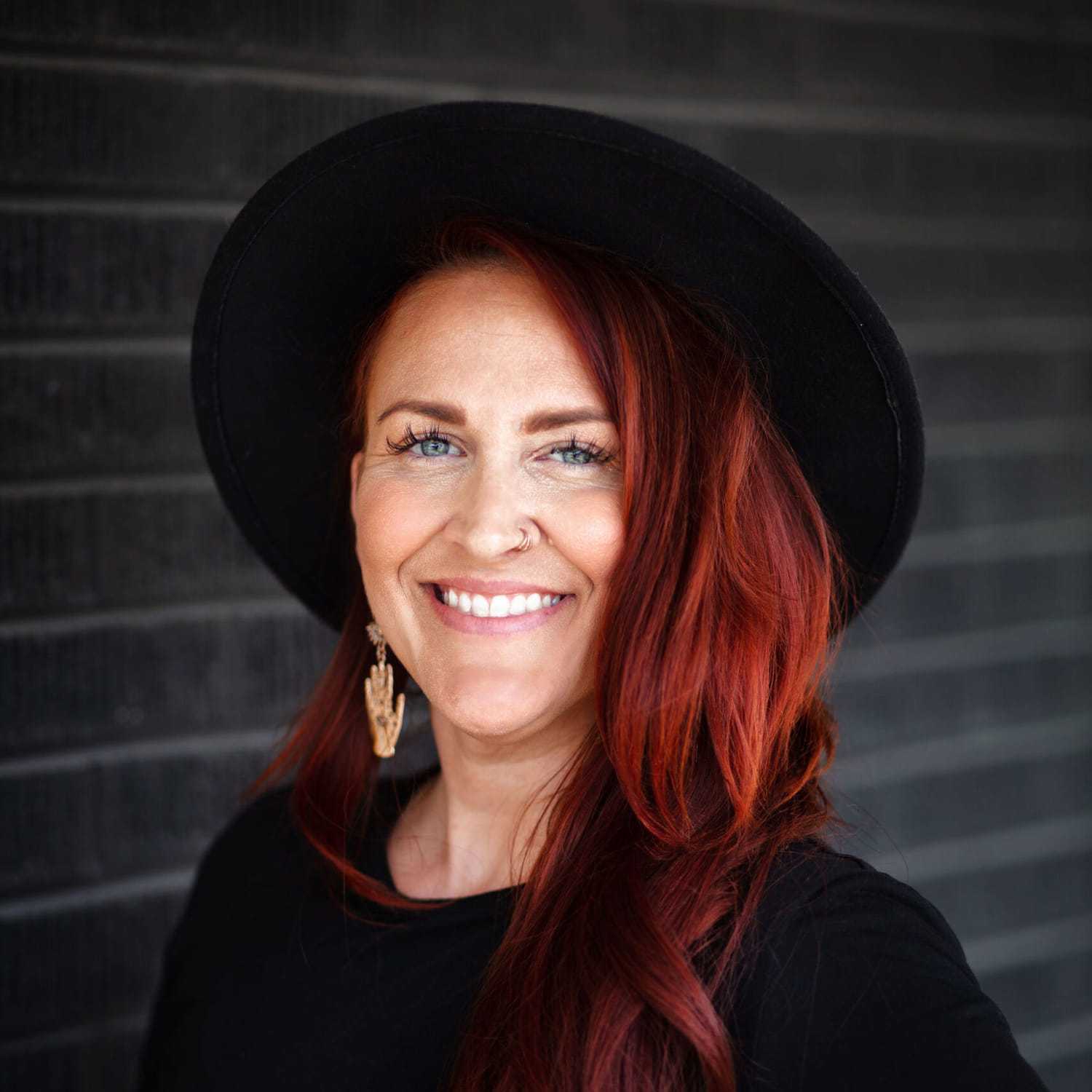 Portrait of Heather Witters, a professional stylist at Style Bar Salon, showcasing their expertise and style.