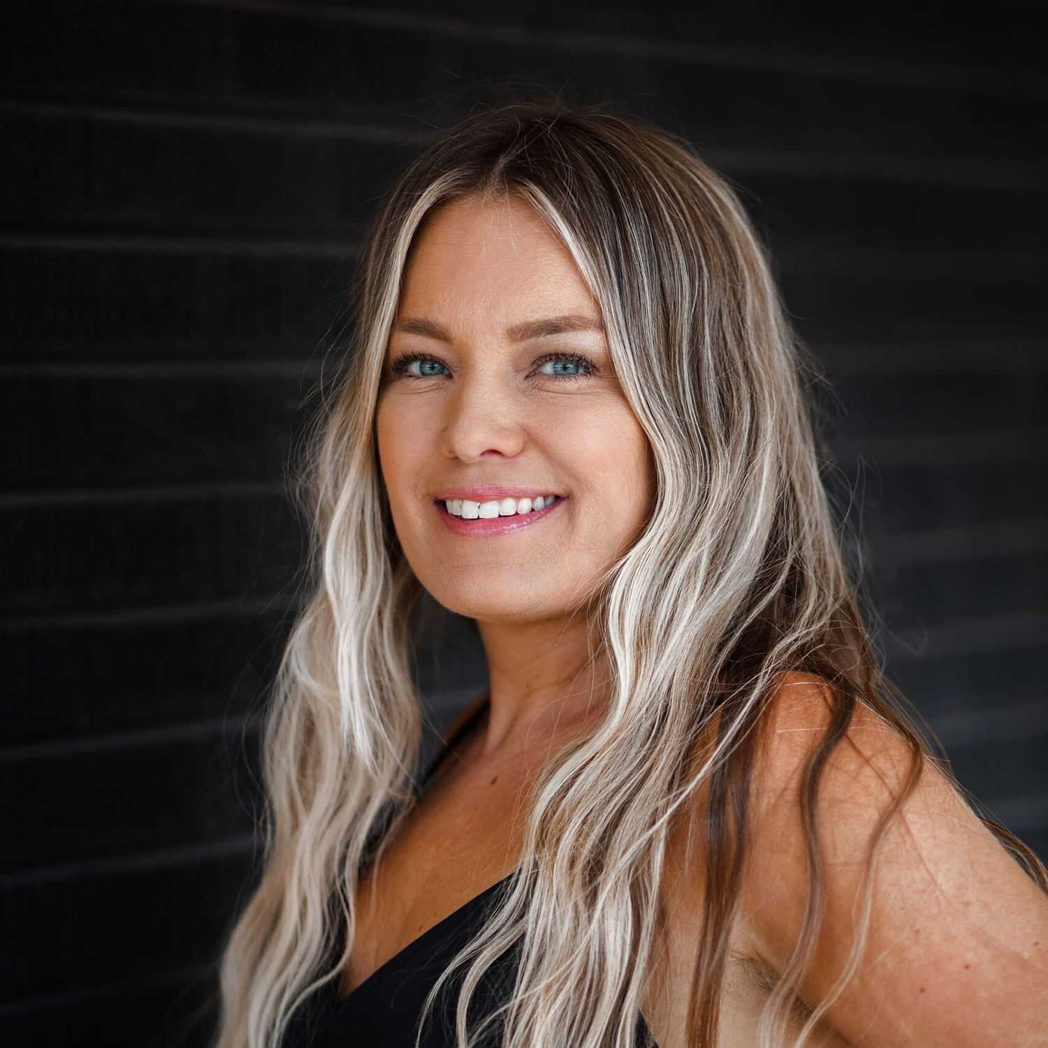 Portrait of Shauna, a professional stylist at Style Bar Salon, showcasing their expertise and style.