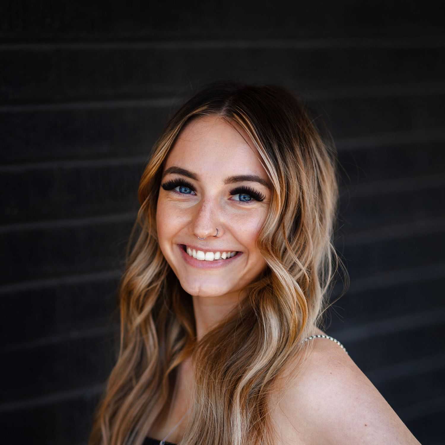 Portrait of Kaela Bernstein, a professional stylist at Style Bar Salon, showcasing their expertise and style.