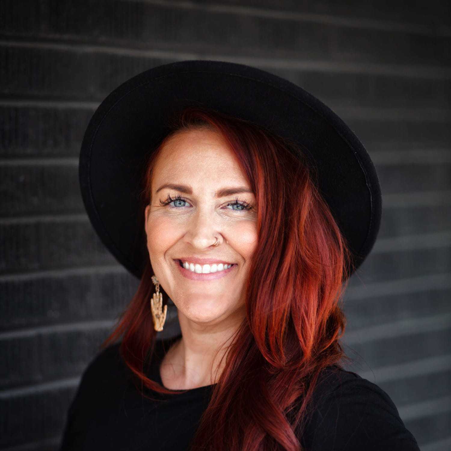 Portrait of Heather Witters, a professional stylist at Style Bar Salon, showcasing their expertise and style.