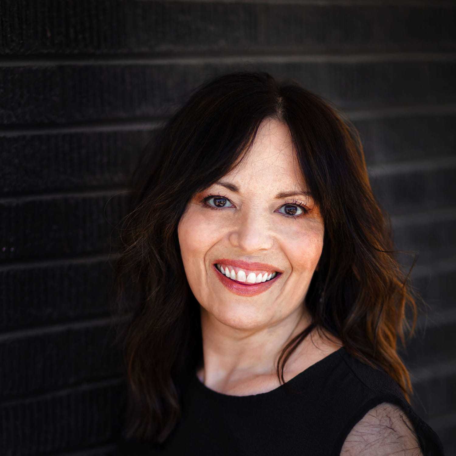 Portrait of Katrina, a professional stylist at Style Bar Salon, showcasing their expertise and style.