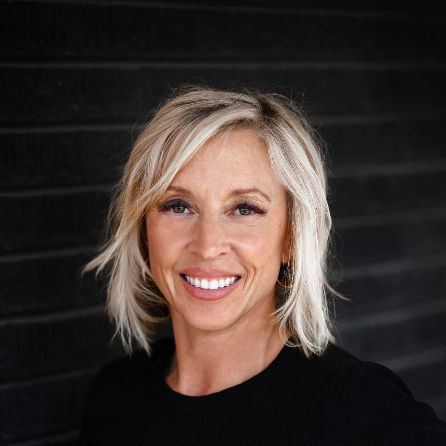 Portrait of Julie Johnson, a professional stylist at Style Bar Salon, showcasing their expertise and style.
