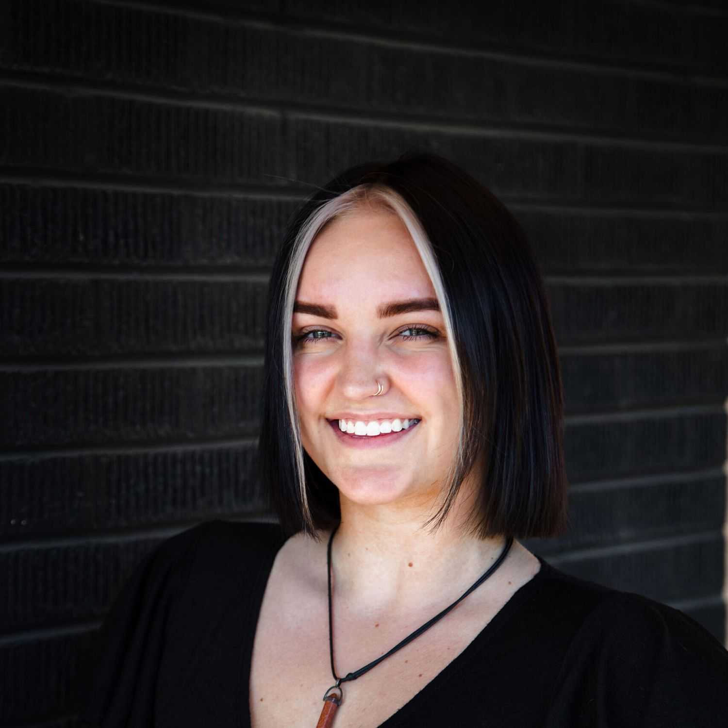 Portrait of Hannah S, a professional stylist at Style Bar Salon, showcasing their expertise and style.