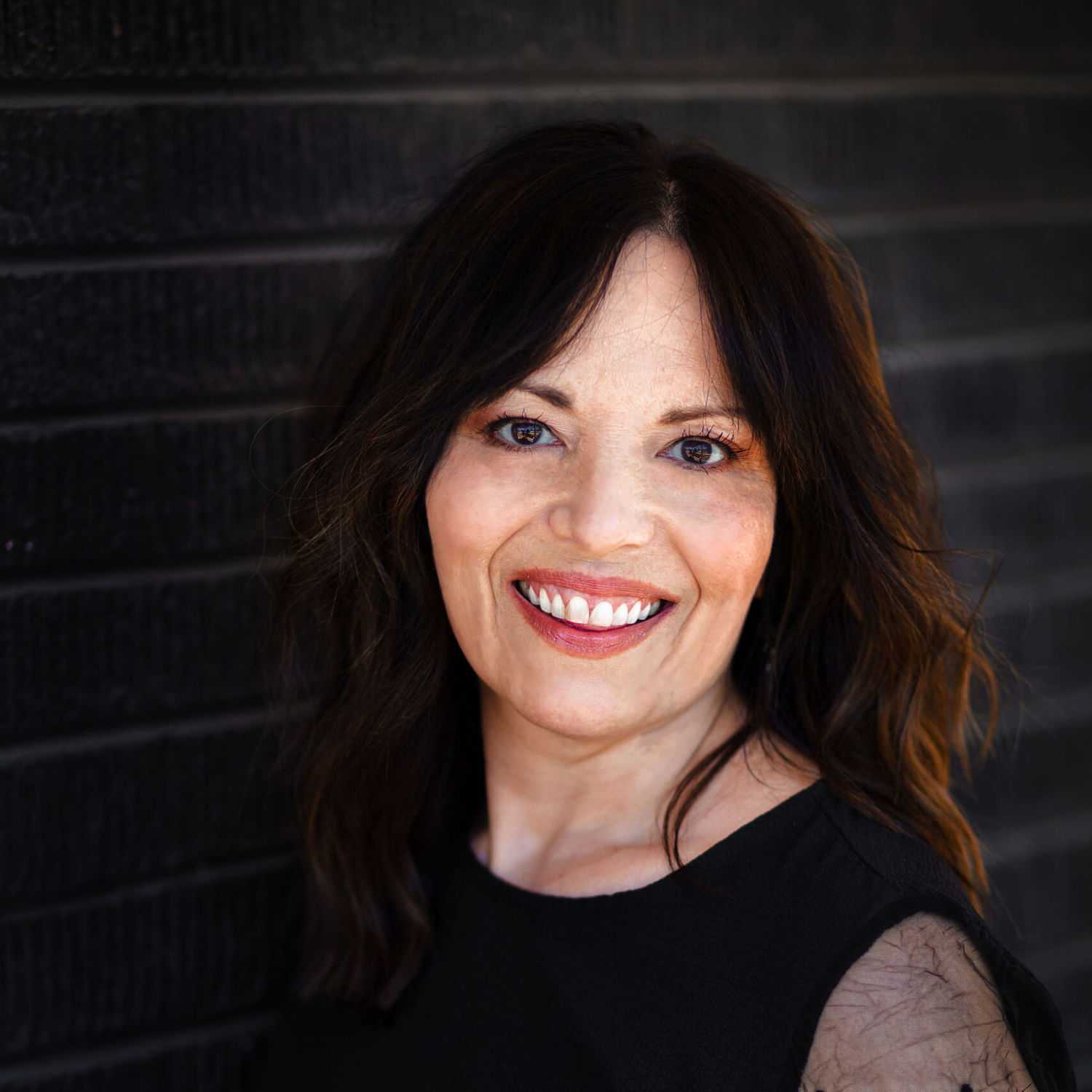 Portrait of Katrina, a professional stylist at Style Bar Salon, showcasing their expertise and style.