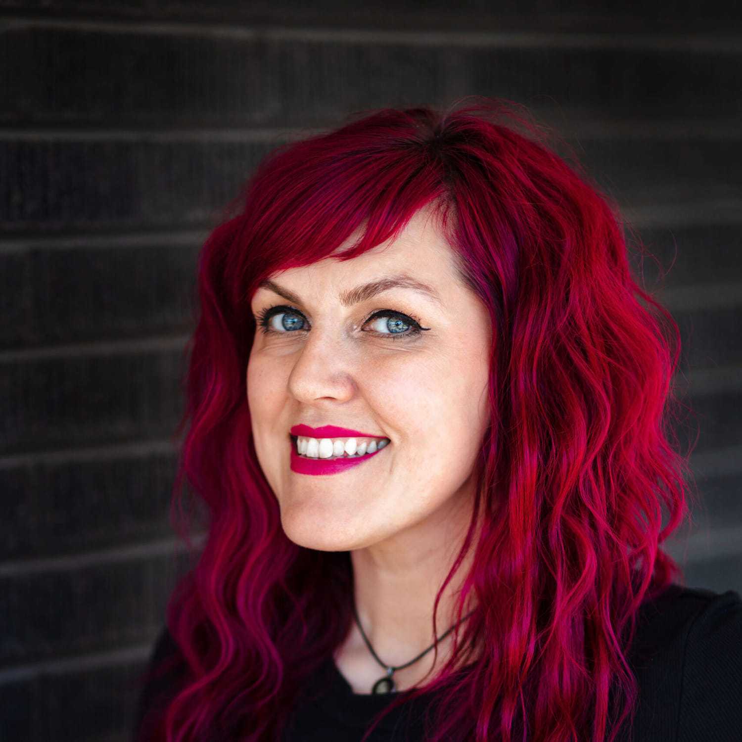 Portrait of Nicole Kuhne, a professional stylist at Style Bar Salon, showcasing their expertise and style.