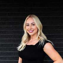 Portrait of Mikayla Bolmes, a professional stylist at Style Bar Salon, showcasing their expertise and style.