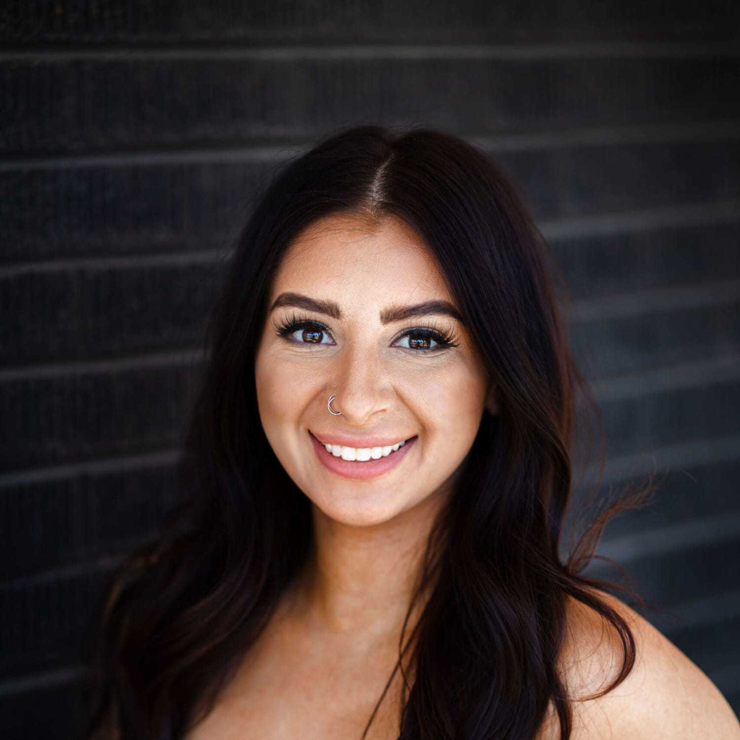 Portrait of Savannah Henke, a professional stylist at Style Bar Salon, showcasing their expertise and style.