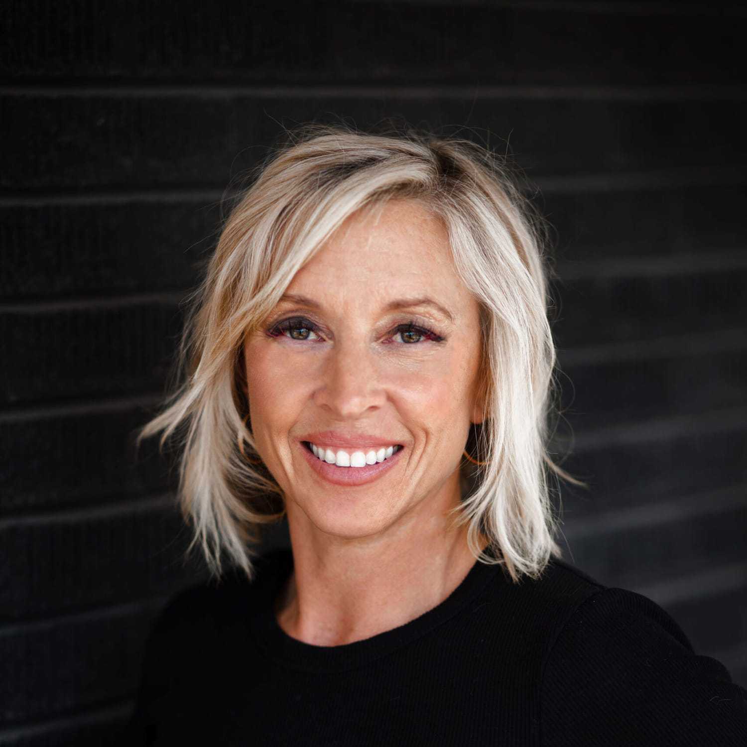 Portrait of Julie Johnson, a professional stylist at Style Bar Salon, showcasing their expertise and style.