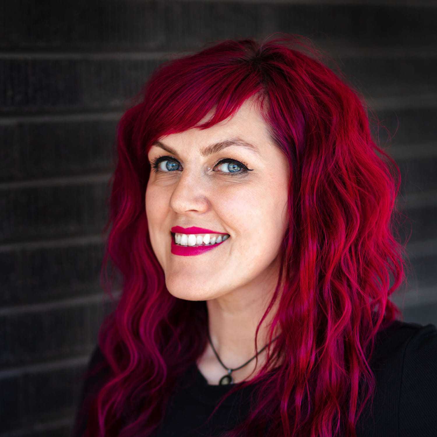 Portrait of Nicole Kuhne, a professional stylist at Style Bar Salon, showcasing their expertise and style.