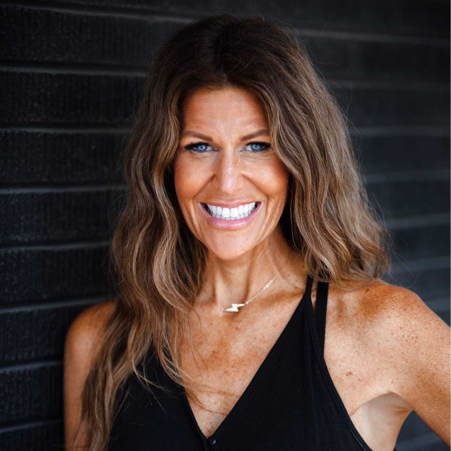 Portrait of Marnie Weir, a professional stylist at Style Bar Salon, showcasing their expertise and style.