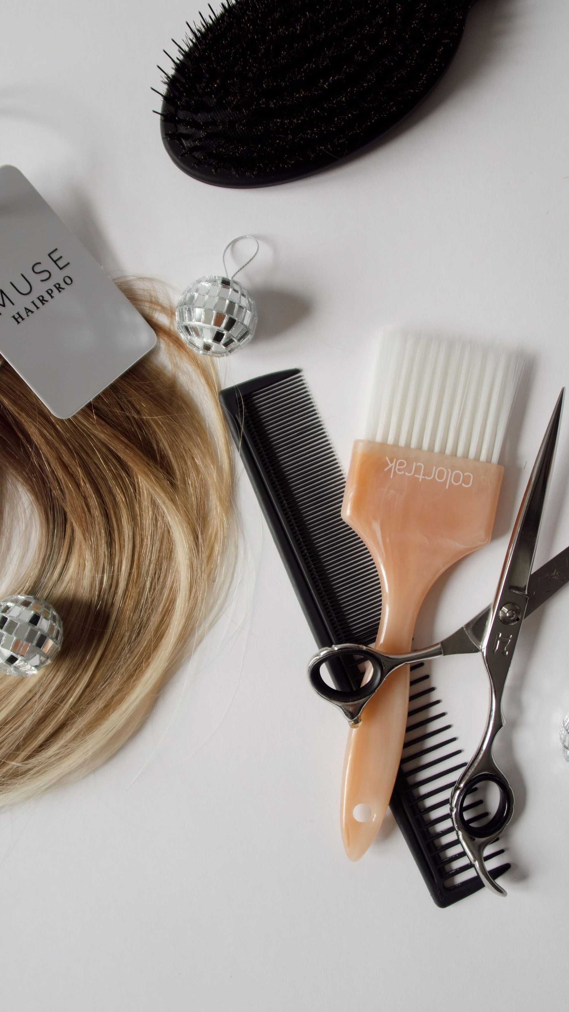 Hair styling tools: brush, comb, scissors, blonde hair extension, dye brush, and small disco balls.