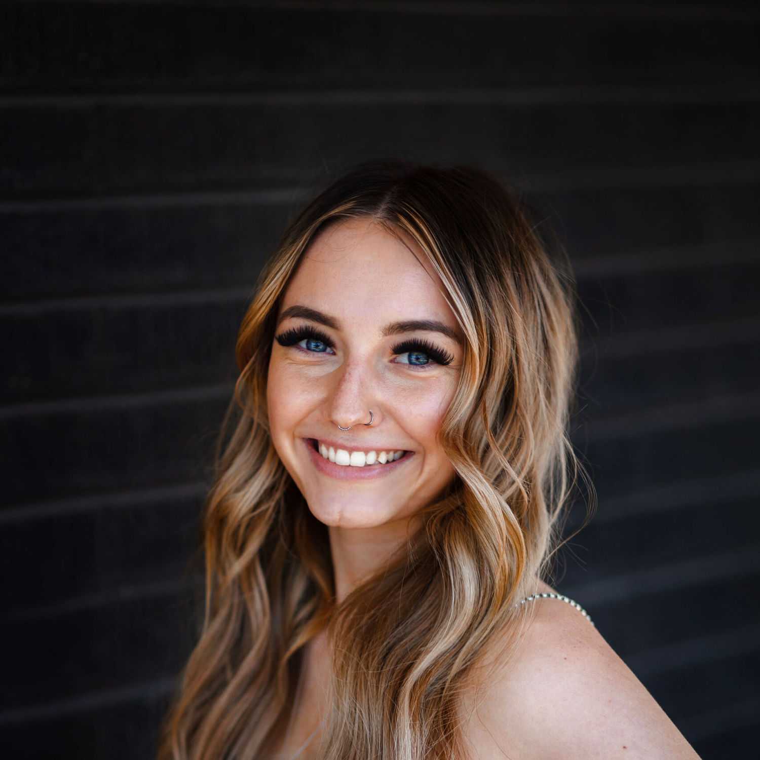 Portrait of Kaela Bernstein, a professional stylist at Style Bar Salon, showcasing their expertise and style.